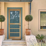 A delightful porch with a blue and beige door and two small trees on either side. The blue and beige color scheme of the door adds a refreshing and calming touch to the scene, while the two small trees provide a natural and organic ambiance. The porch is a welcoming and cozy space, perfect for spending time with family and friends.