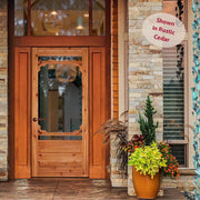 A charming wooden door on a beautifully crafted wooden porch, exuding a rustic and inviting atmosphere.
